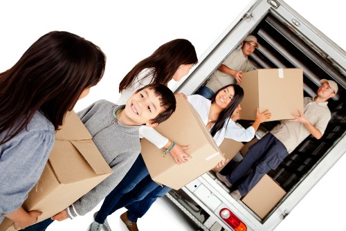Removal team preparing furniture safely for transport
