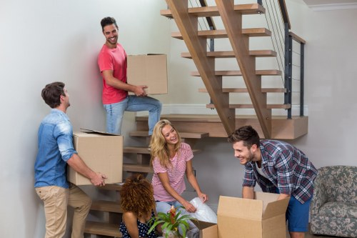Professional furniture removal team arranging a collection in Barnes