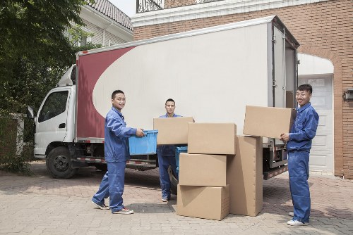 Furniture removals team handling household items in Barnes