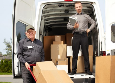 Office removals planning in Barnes with moving boxes and workspace setup