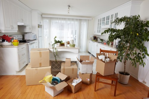 Barnes Removals crew handling packed boxes during a move