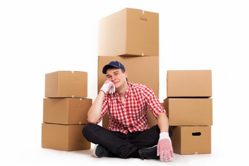 Professional movers handling furniture in a Barnes apartment