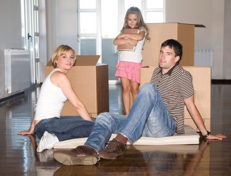 Professional movers placing furniture into a Barnes property